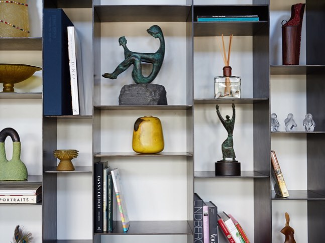 Blackened Steel shelving make for a great twist for curios. Built by @foursquarebuilders