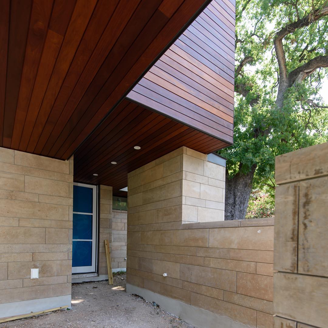 Carport entry to our Castle Hill home. Ipe Rainscreen and Cinnamon Lueders frame this back entry. Built by @foursquarebuilders Designed by @dc_architecture Photo by @redpantsstudio