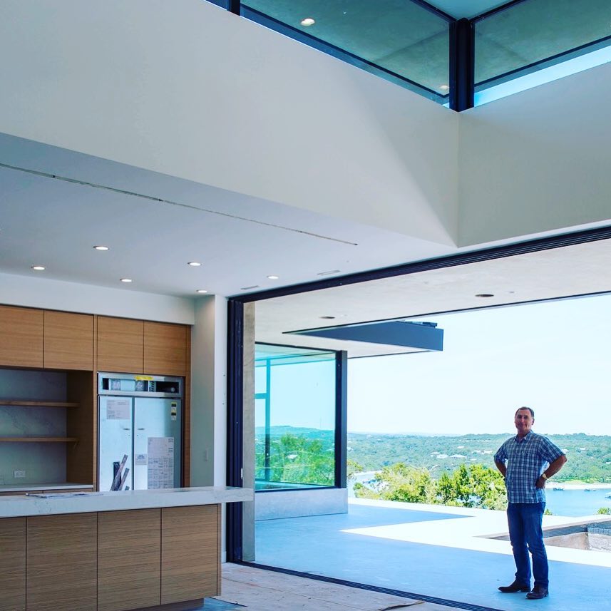 A room with a view. Wasn't that the name of a movie? If not, it should be. Designed by @dc_architecture Built by @foursquarebuilders Sliding doors by @fleetwood_windows_doors Cabinets by @flitchbyhw Photo by @redpantsstudio