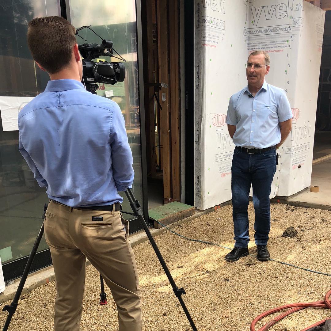 On location being interviewed by KXAN. Topic: How has all the rain impacted construction in Austin, Texas.