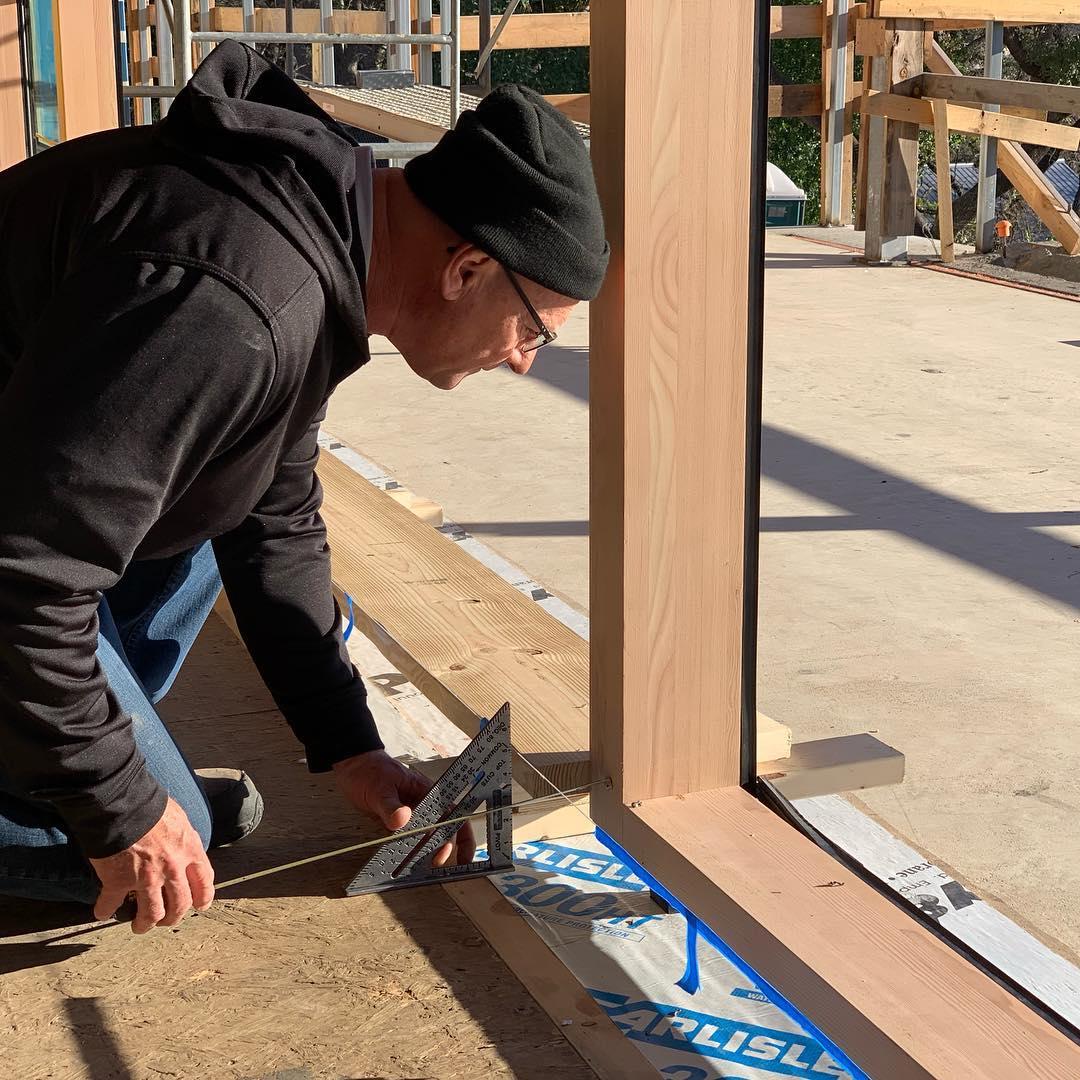 Frank with @loewenwindows checking and double checking tolerances on our Timber Frame Lift and Slide door install. Our clients rely heavily on our team of experts to guide them through the build process. Designed by @laruearchitects Built by @foursquarebuilders Interiors by @lovecounty