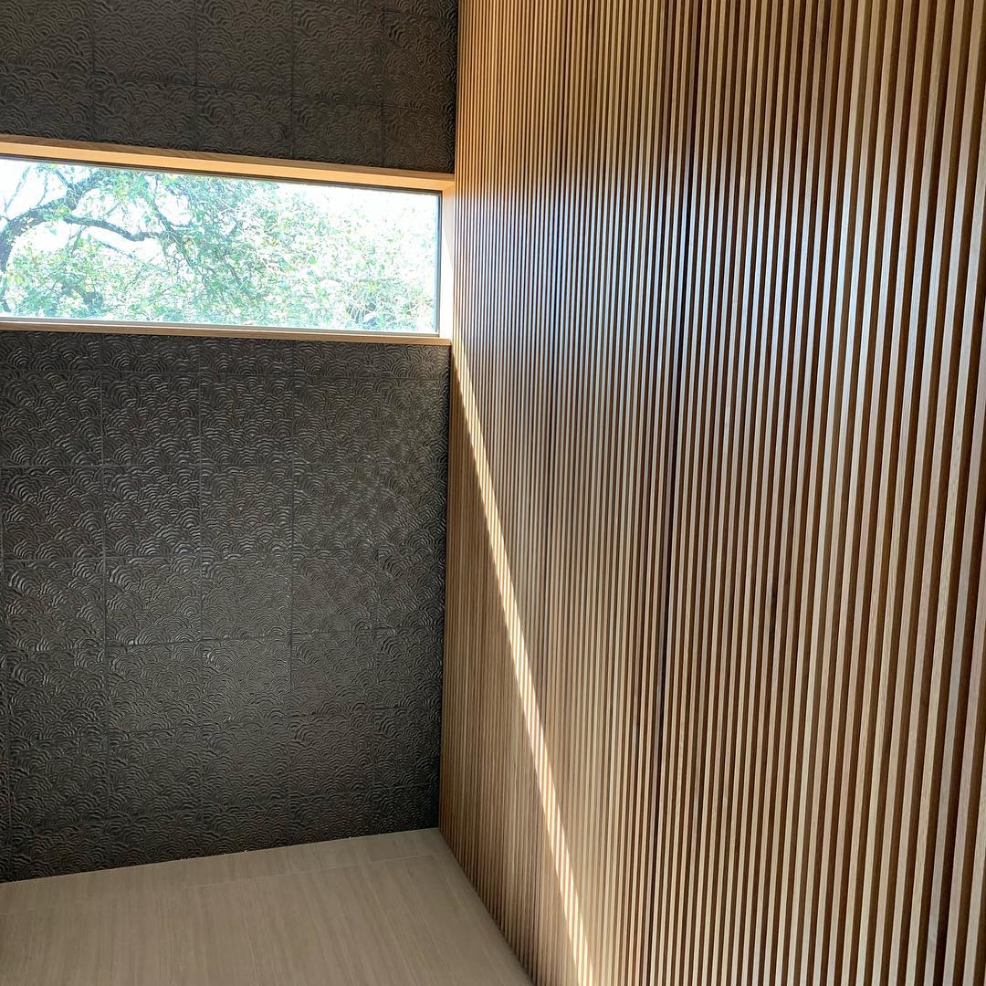 And the slat wall continues into the bathroom. Designed by @dc_architecture Built by @flitchatx and @foursquarebuilders