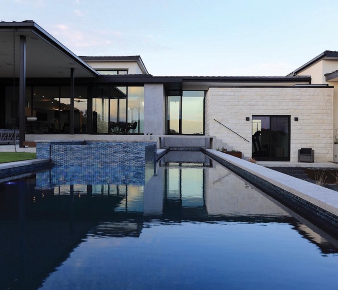 75’ lap pool is the center piece of this @lankerani_architecture home.