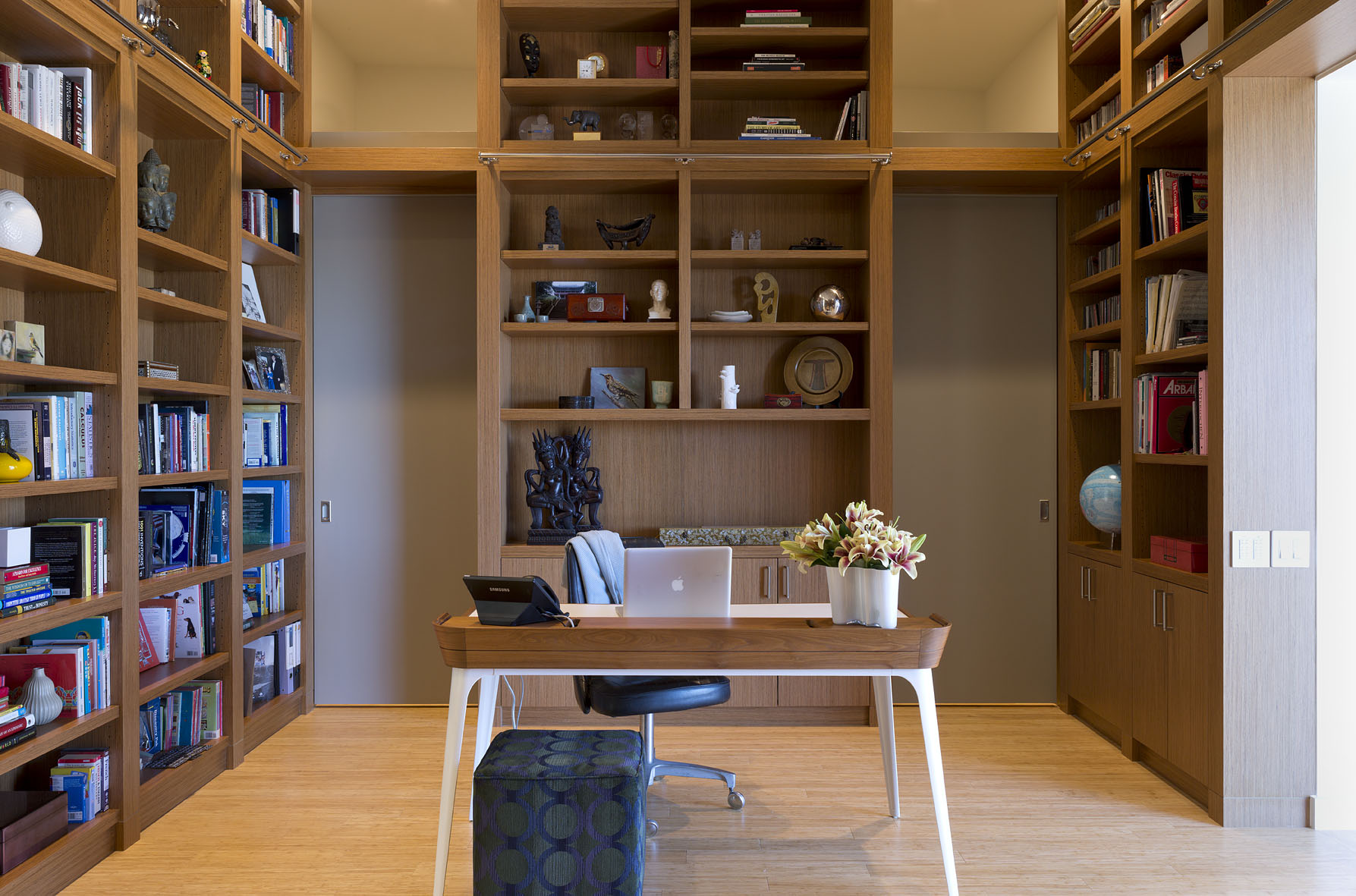 The owner's library also serves as a transition space into the master suite.