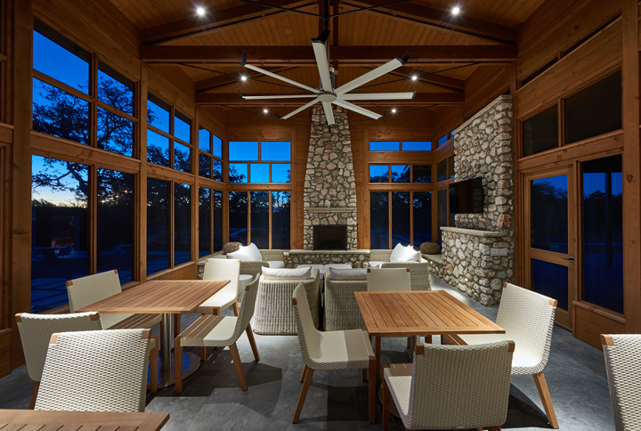 Outdoor dining is available via this cedar and stone screened summer porch.