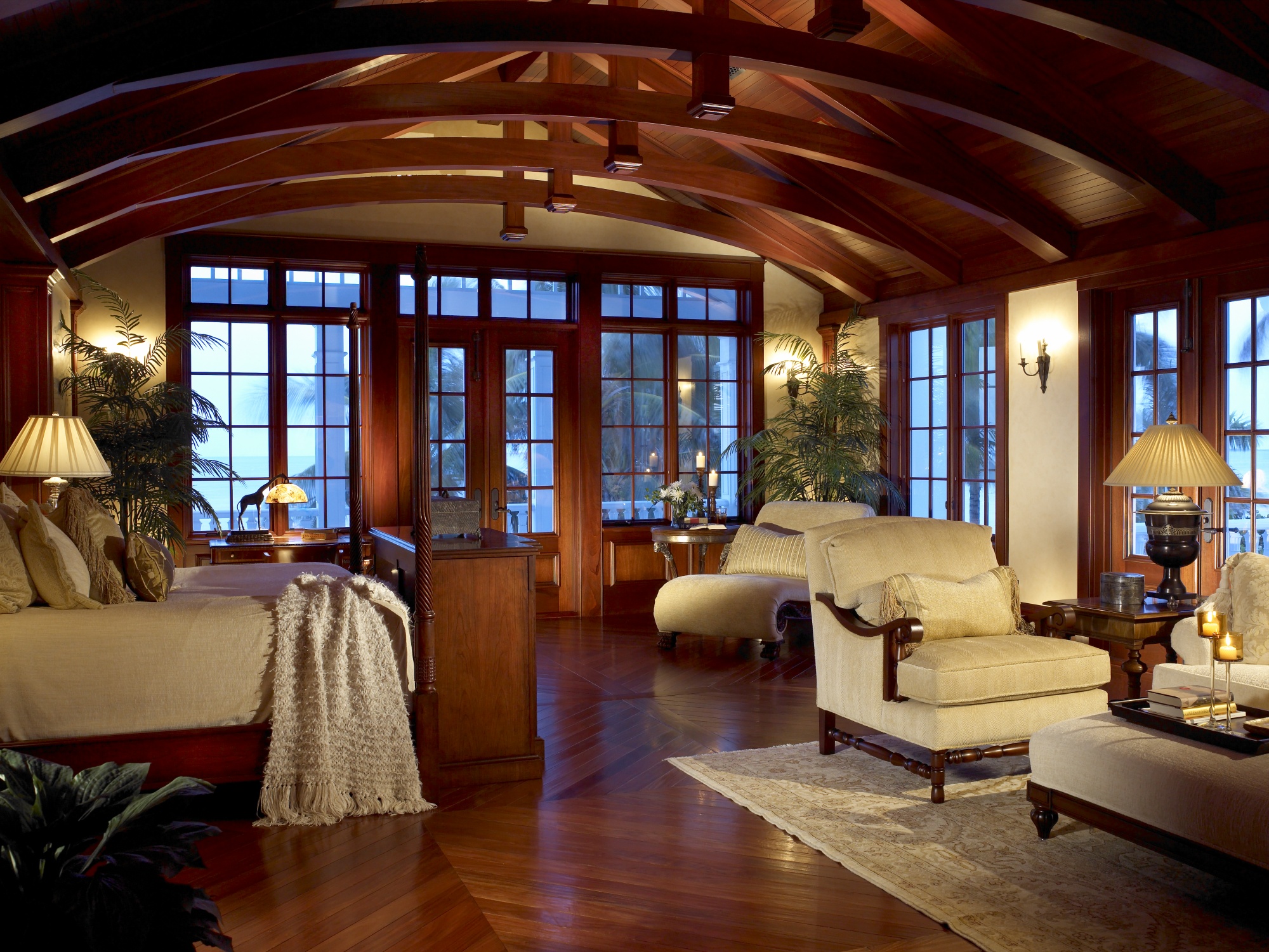 Exposed mahogany beams and venetian plaster walls are featured in the master bedroom.