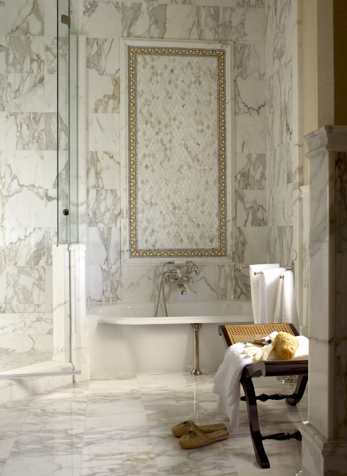 Marble mosaic tiles and nickel finishes within this guest bathroom.