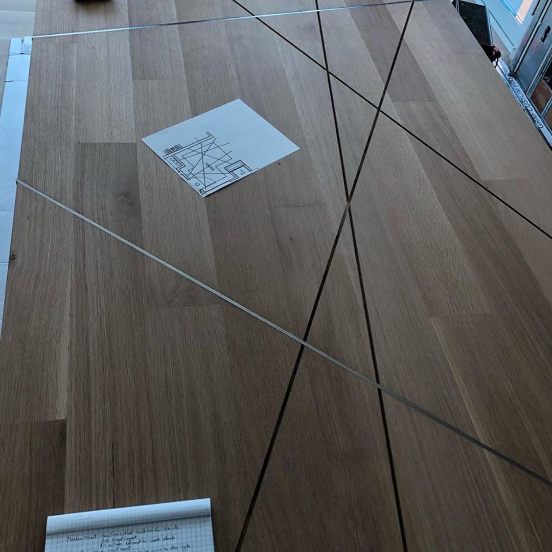 Full size mock up of inlaid cold rolled steel in Rift sawn white oak flooring at our @theindependentaustin penthouse project. Great work by our project manager @hahneric and our flooring professional @ingrainedbynature Interiors by @urbanspaceinteriors