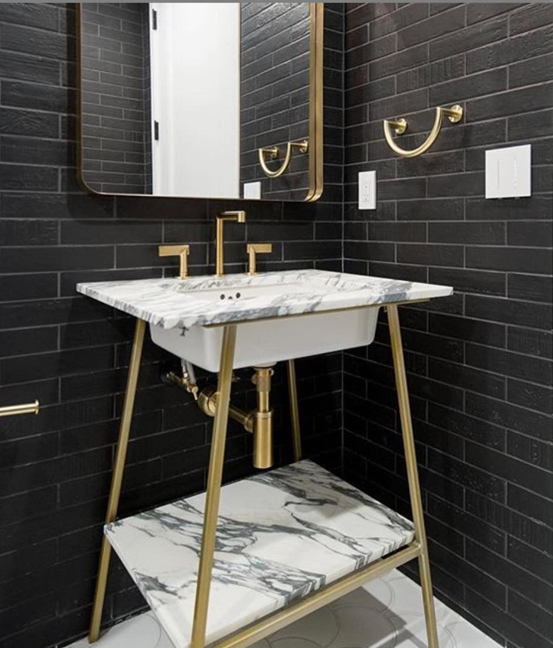 This custom-designed vanity by @slicinteriors was the cherry on top of this powder room.