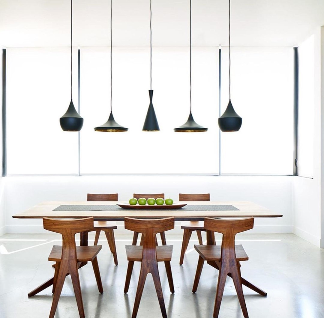 Varying pendant lighting gives this beautiful room a grand centerpiece.