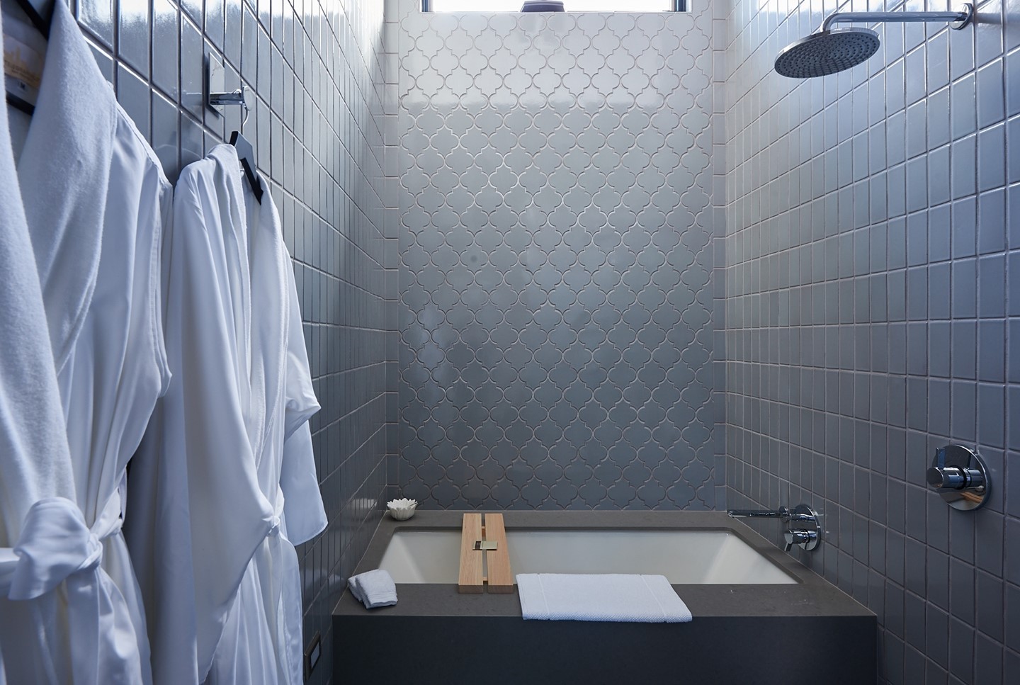 A spa-like retreat complete with cozy robes and a rainfall showerhead.