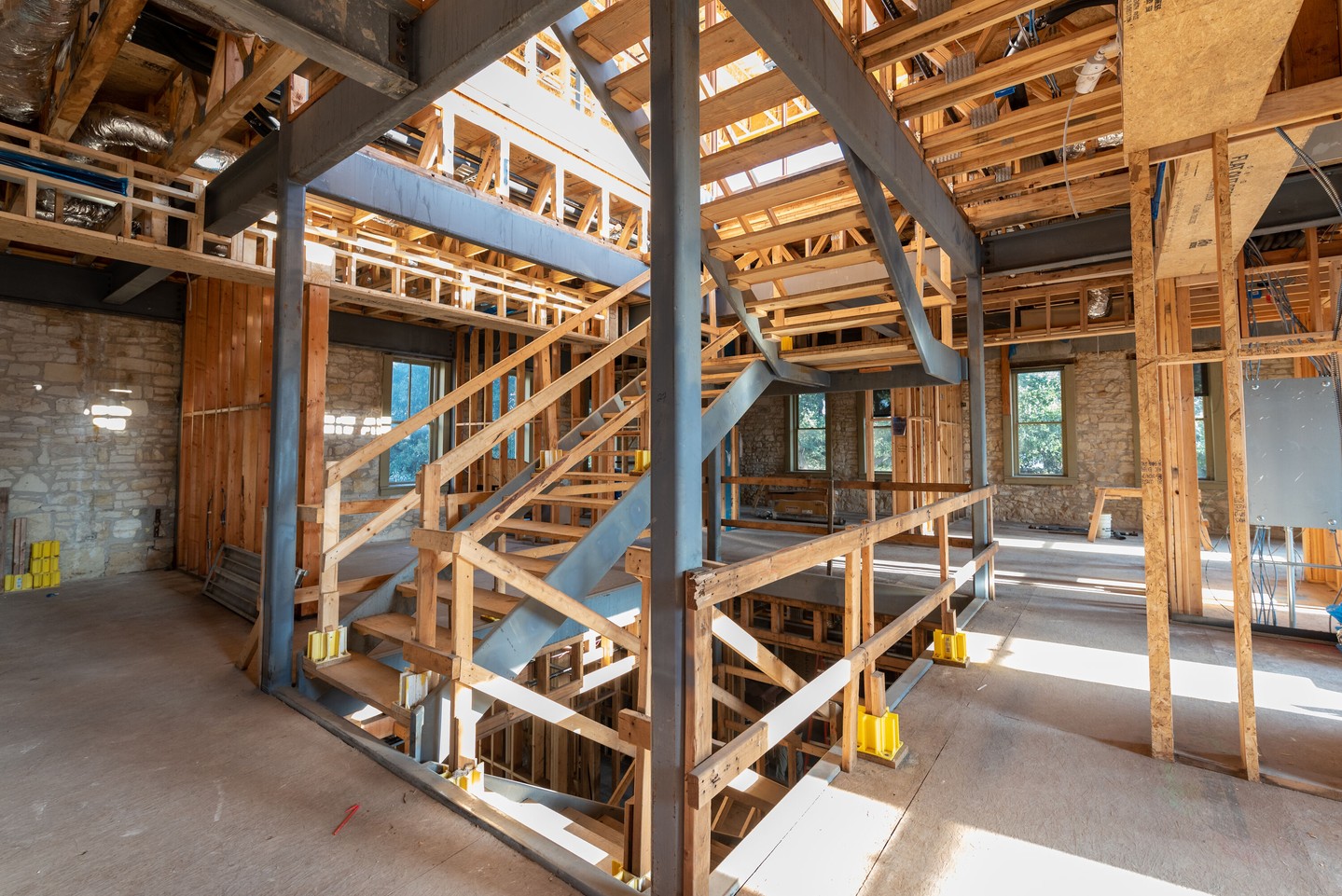 This renovation balances structural needs with design vision. The multi-story stair element creates a light well, bringing natural light to the lower floors. Metal stair stringers provide support, while the temporary wood treads will soon be replaced with the final look. What type of finished flooring would you envision in this transformed space?

Architect: @chioco_design
Structural Engineer: @dciengineers